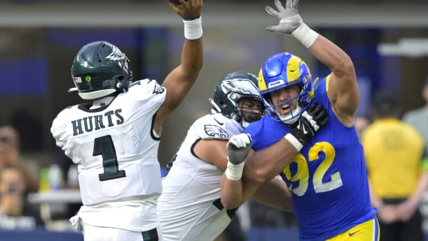 Oct 8, 2023; Inglewood, California, USA; Los Angeles Rams defensive end Jonah Williams (92) defends against Philadelphia Eagles quarterback Jalen Hurts (1) in the second half at SoFi Stadium.